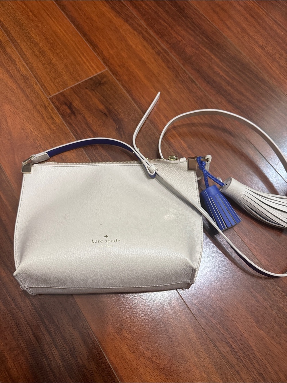 kate spade Cream Leather Crossbody with Blue Tassel Accent